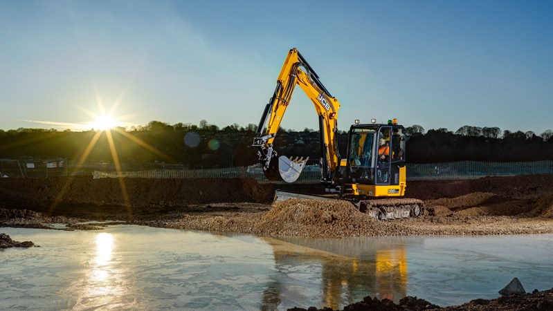 Mini Ex 86C-2 (3x2) Excavating with Sunsetting in background