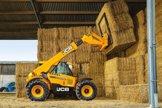 Series III Loadall lifting hay