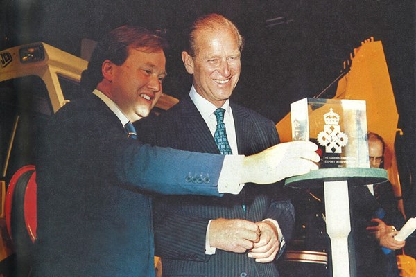 1981 Prince Philip presents Anthony Bamford with the Queen's Award for Export