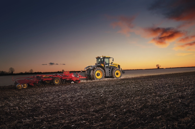Fastrac 8330 iCON ploughing at sunset