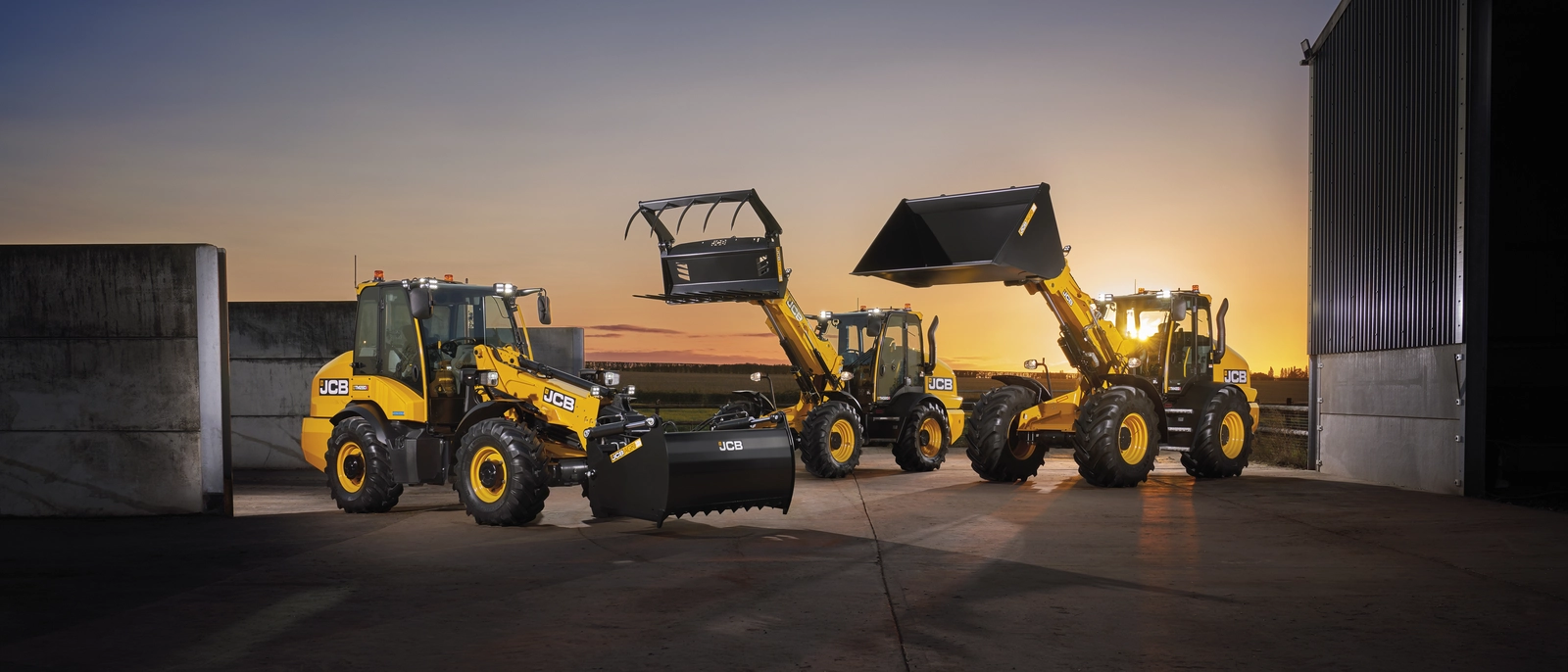 TM280S, TM320S and TM420S in a yard at sunset