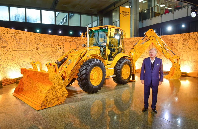 Lord Bamford with 1,000,000 Backhoe Loader