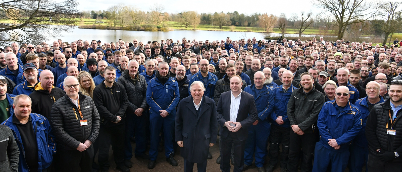 Backhoe Loader Employees celebrating 1,000,000 Backhoes