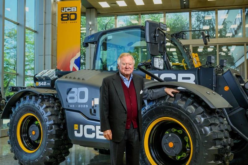 Lord Bamford stood with 80th year Loadall
