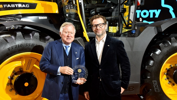 Lord Bamford and George Bamford accepting Tractor of year Fastrac 600 award news
