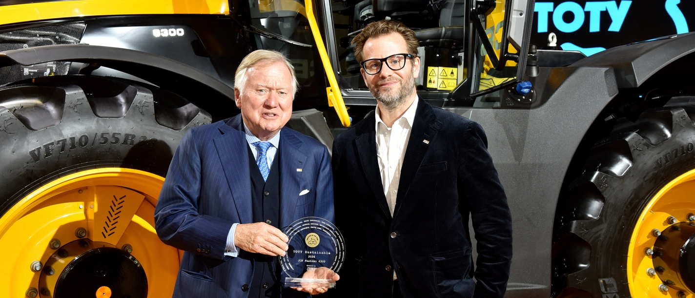 Lord Bamford and George Bamford accepting Tractor of year Fastrac 600 award news