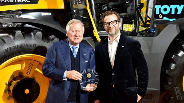 Lord Bamford and George Bamford accepting Tractor of year Fastrac 600 award news
