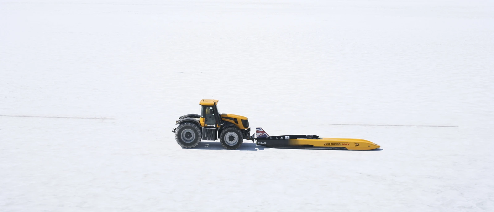 Fastrac 8250 pushing Dieselmax on saltflats