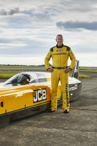 JCB Hydromax with driver Wing Commander Andy Green OBE at RAF Wittering