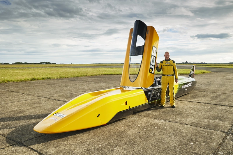 JCB Hydromax with driver Wing Commander Andy Green OBE at RAF Wittering