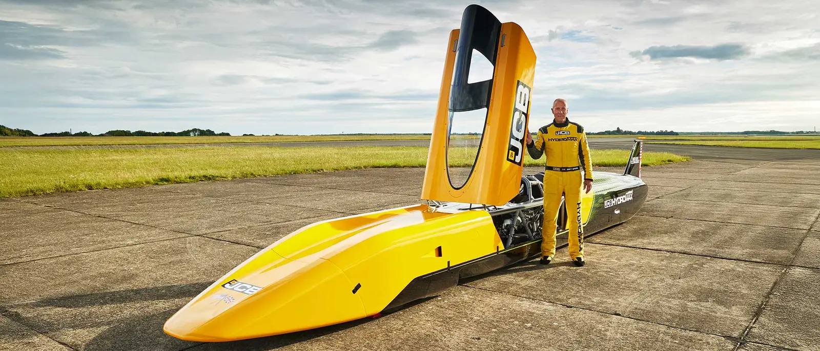 JCB Hydromax with driver Wing Commander Andy Green OBE at RAF Wittering 21x9