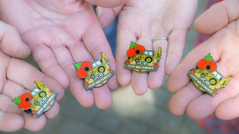 Retired firefighter digs deep for poppy appeal with JCB badge