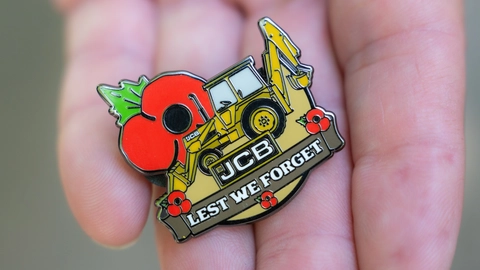 Retired firefighter digs deep for poppy appeal with JCB badge