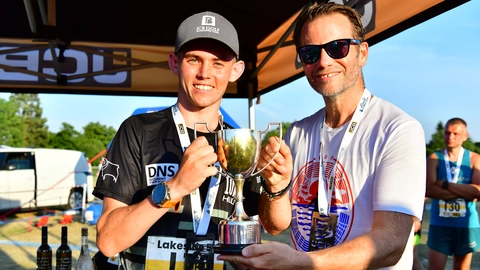 Ruarc Grant (left) is presented with hsis trophy by George Bamford