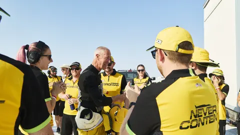 Andy Green OBE celebrates with the JCB team
