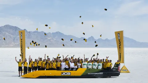 JCB Hydromax Team celebrate 406.320 mph world land speed record with the Bamford family.