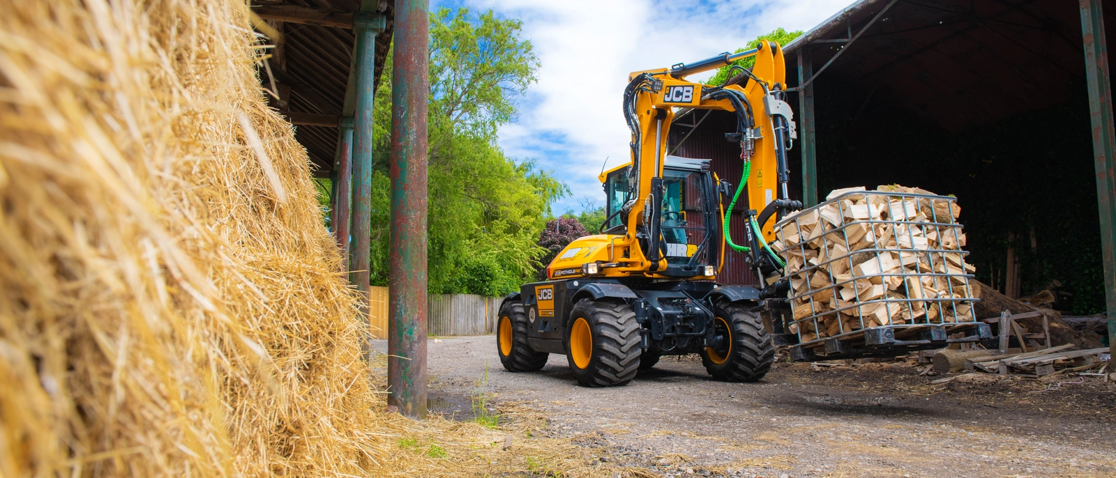 HRP Contracting JCB Pothole Pro carrying wood