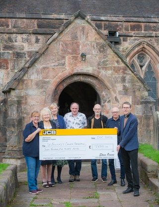 Pictured outside St Edward’s Church are (left to right): JCB Group Transport and Garage Manager Carole Ball with parishioners Pam Kinshott, Rosie Yardy, Kevin Pointon, Paul Wagg, Roy Copper, and vicar The Revd. Dr. Henry Hope.