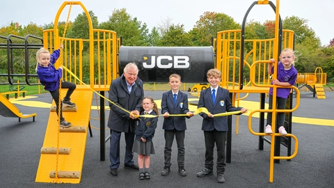 Pictured at the opening of the new Rocester village playground are, left to right, Thea (5) of Dove Academy, Rocester, JCB Chairman Lord Bamford, with the daughter of JCB project leader David Wheeldon,  Amelia (6) of Saint Filumena’s Primary School, Caverswall, Riley (10) and Bobby (10) both of Ryecroft Middle School, Rocester and Demi (5) of Dove Academy, Rocester.