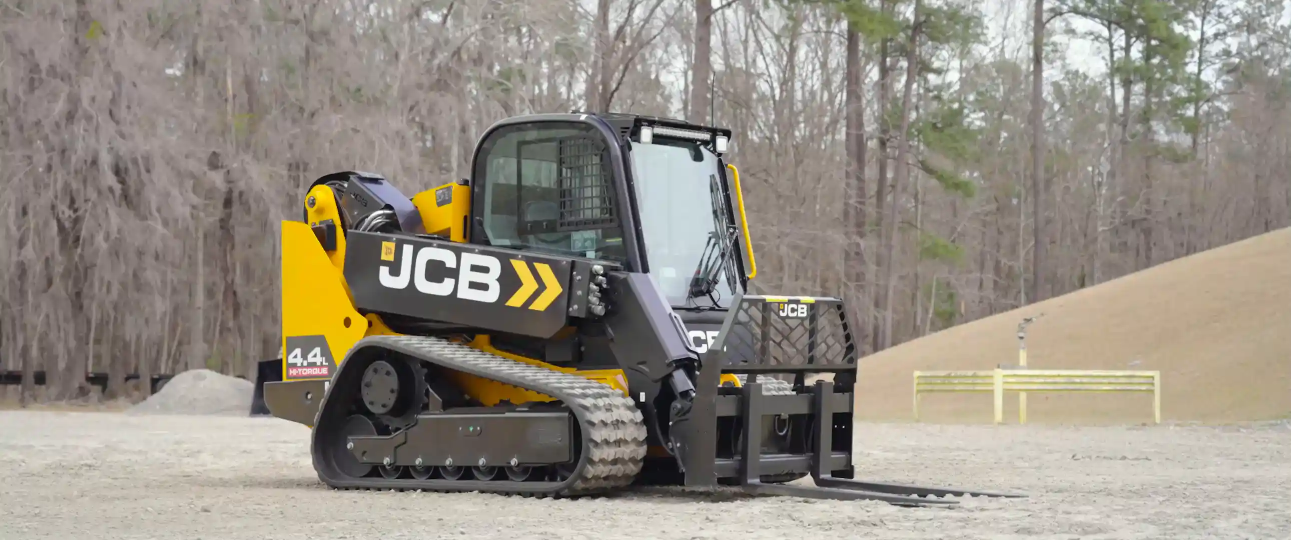 JCB Teleskid showcasing telescopic boom extension, fork attachment handling, shovel attachment in operation demonstrating digging depth, and a view of the engine, all on rough gravel terrain